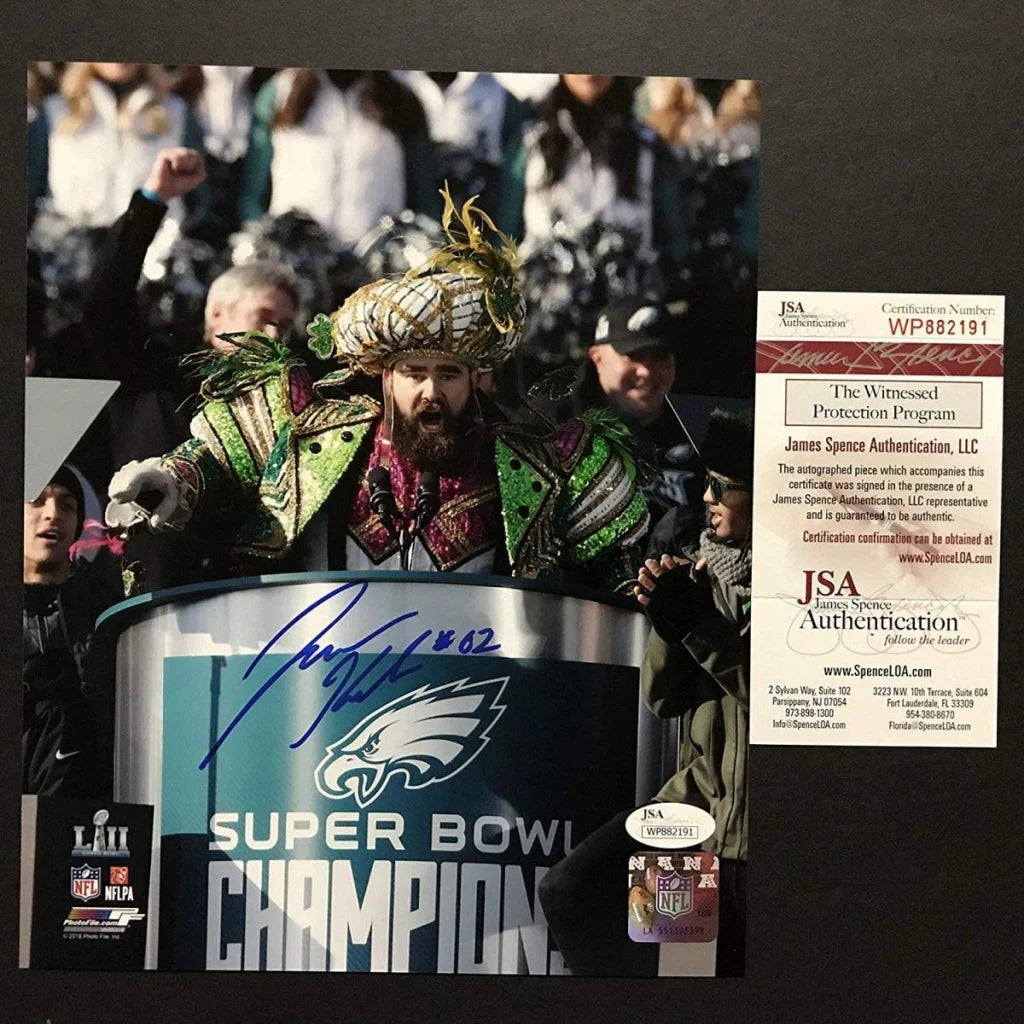 Philadelphia Eagles super bowl champion trophy with signature and JSA authentication sticker displayed on green base