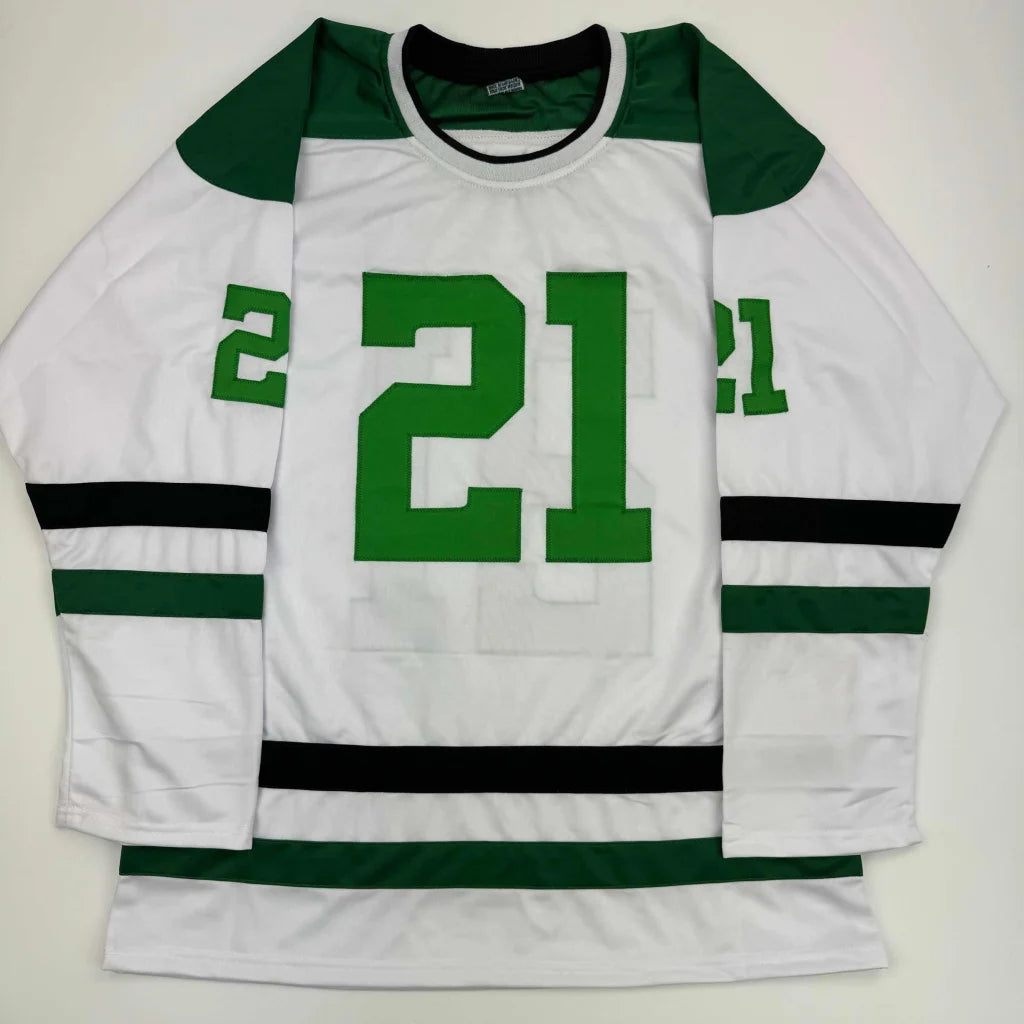 White professional sports league custom jersey with green shoulders and number 21