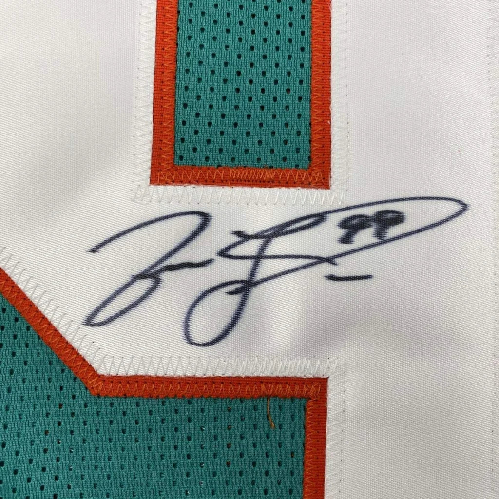Autographed teal and orange custom jersey from professional sports league Miami Dolphins Taylor 99