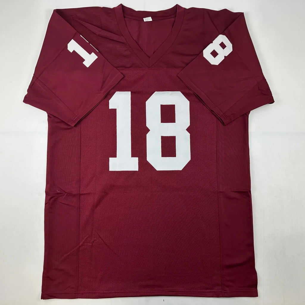 Maroon custom football jersey with white 18 number signed by J White and ED Heuman