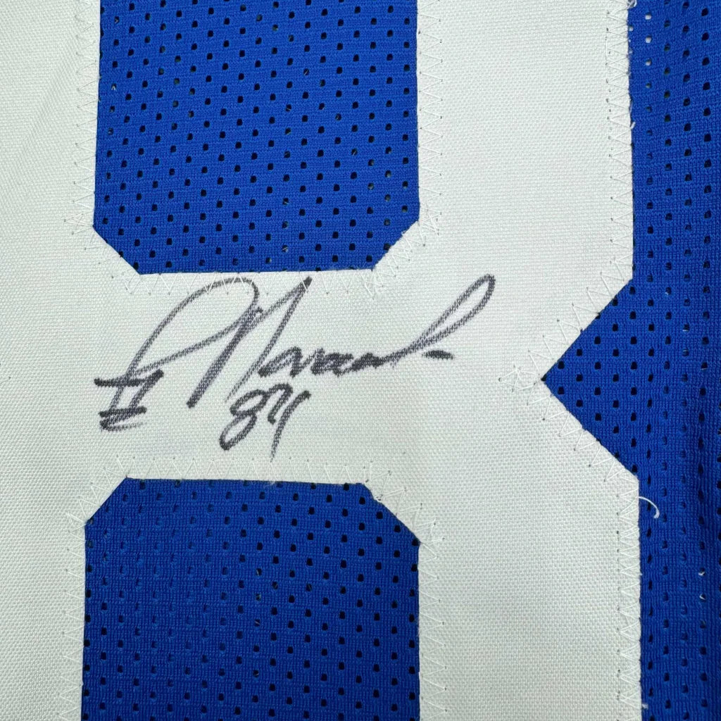 Blue and white custom jersey signed by Jay Novacek from the professional sports league