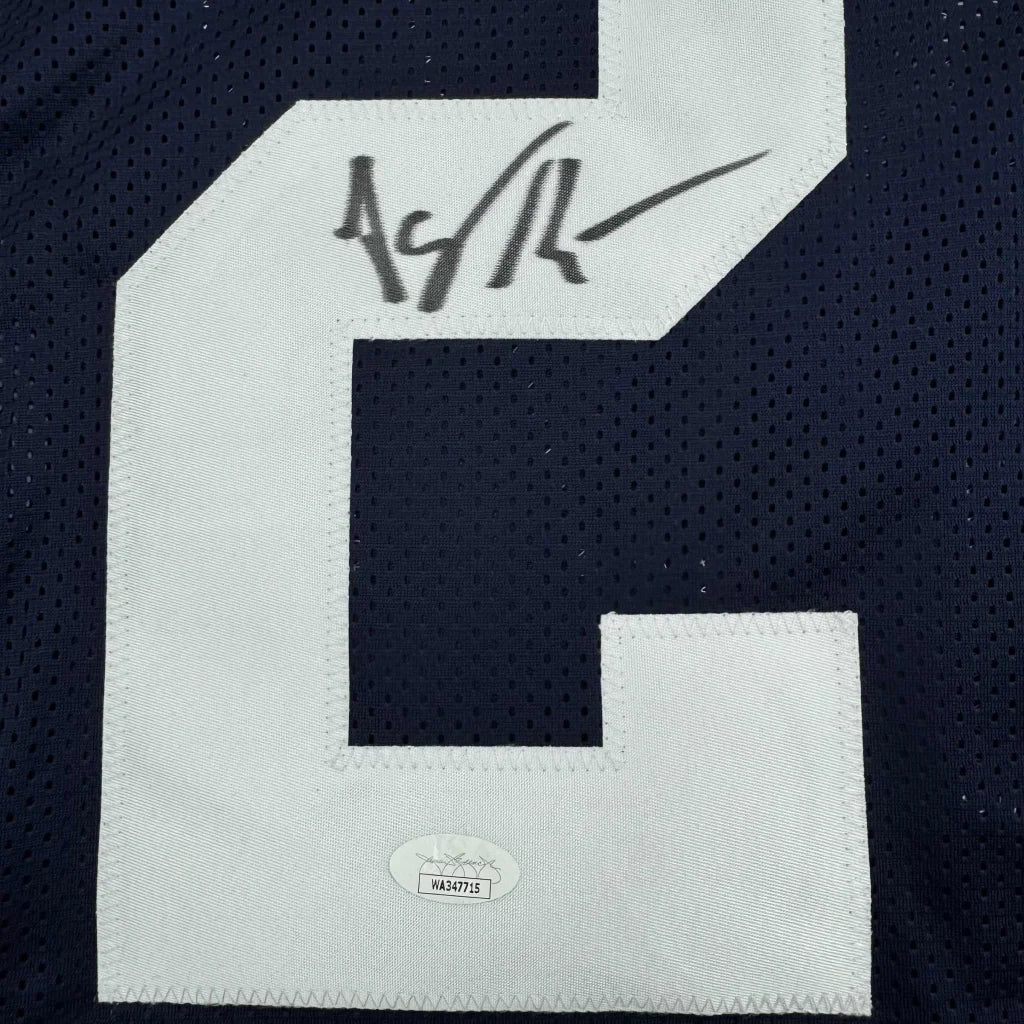 Autographed dark blue custom jersey signed by a professional sports legend in the sports league