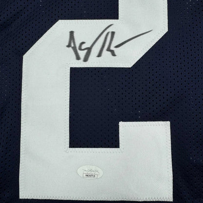 Autographed dark blue custom jersey signed by a professional sports legend in the sports league
