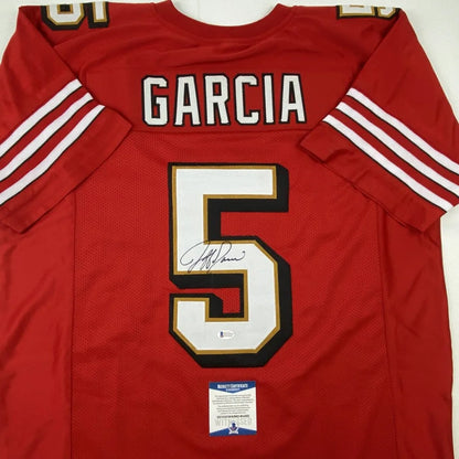 Back view of a red san francisco 49ers custom jersey with garcia 5 signed for professional sports league fans