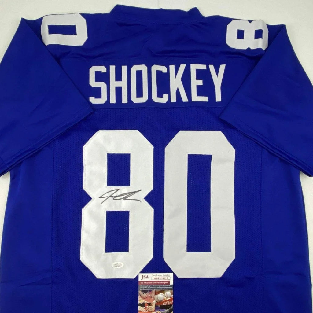 Royal blue autographed Jeremy Shockey football jersey with white lettering number 80 from professional sports league