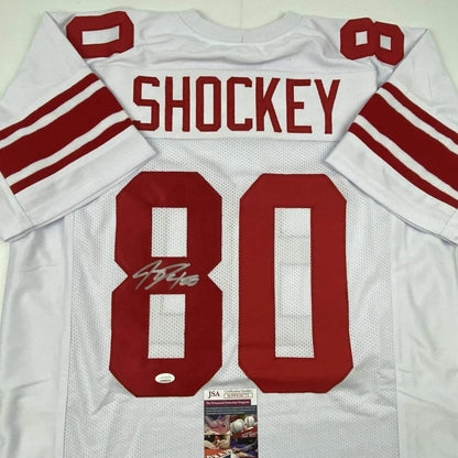 Autographed Jeremy Shockey #80 football jersey from professional sports league display