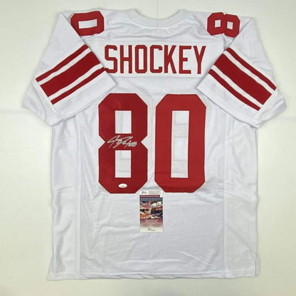 Autographed Jeremy Shockey New York White Football Jersey with JSA COA, perfect for pro sports fans