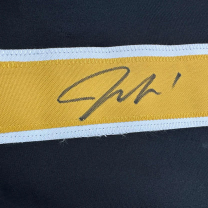 Yellow stitched Jeremy Swayman signature patch on custom Boston Bruins pro hockey jersey