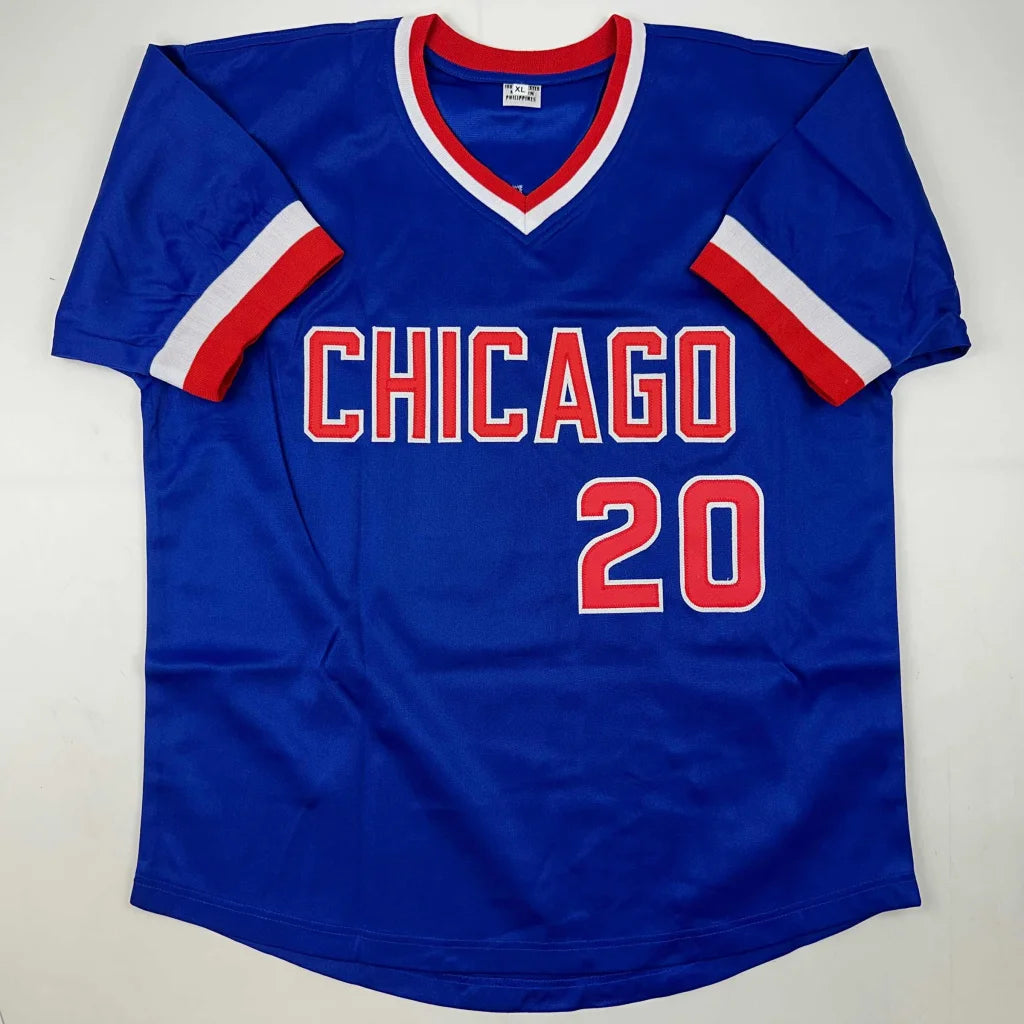 Blue short-sleeved V-neck jersey with red and white trim from Authentic Jeanne Walton custom jersey in professional sports league