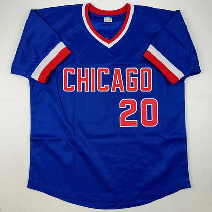 Blue short-sleeved V-neck jersey with red and white trim from Authentic Jeanne Walton custom jersey in professional sports league