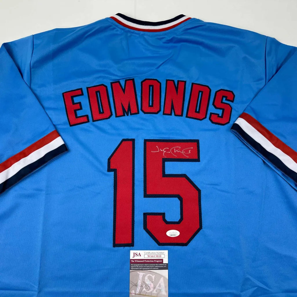 Light blue custom jersey with red numbers and signature from a professional sports league