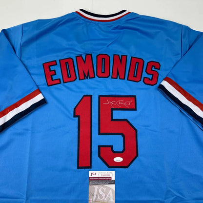 Light blue custom jersey with red numbers and signature from a professional sports league