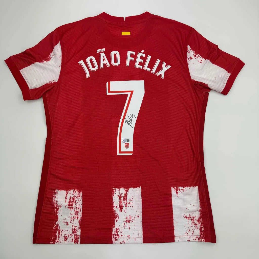 Back of autographed Joao Felix Atletico Madrid red and white striped custom jersey with number 7 for professional sports league use