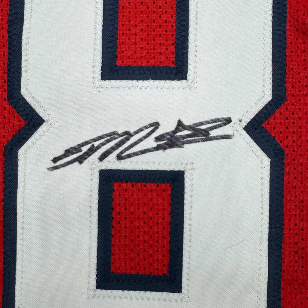 Autographed red and white custom jersey with number 8 from a professional sports league