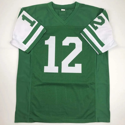 Green and white custom Joe Namath football jersey with number 12 v-neck and sleeve stripes from professional sports league