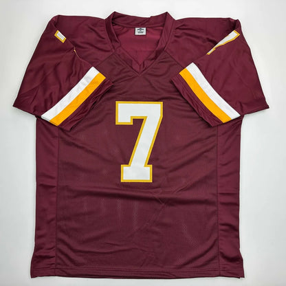 Maroon short-sleeved custom jersey with white and gold number 7 for professional sports league