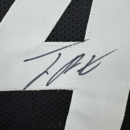Black and white custom jersey signed by a pro athlete from a sports league