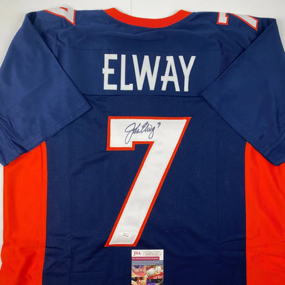 Back of a blue and orange denver broncos custom jersey with white elway nameplate and number 7 in bold white outlined in red