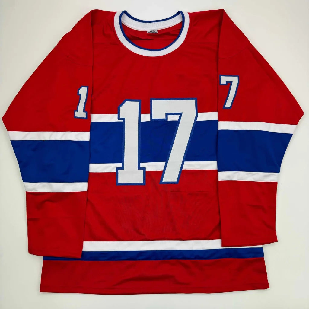 Red hockey jersey with blue and white stripes and number 17 from a professional sports league