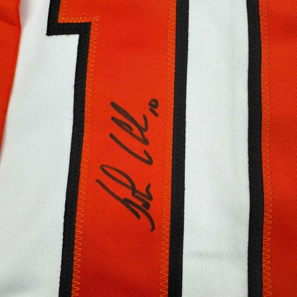 Orange and white custom jersey from professional sports league with autograph