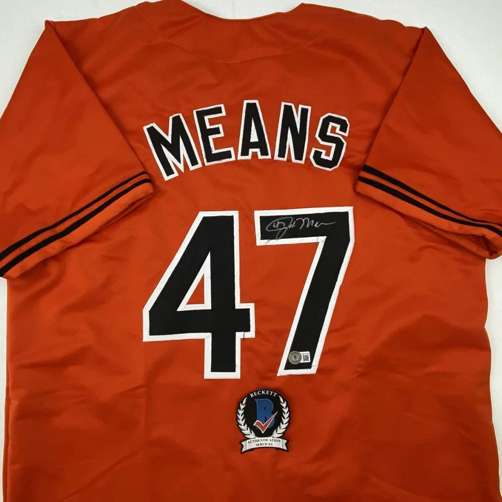 Orange custom jersey with black and white numbers for professional sports league gear