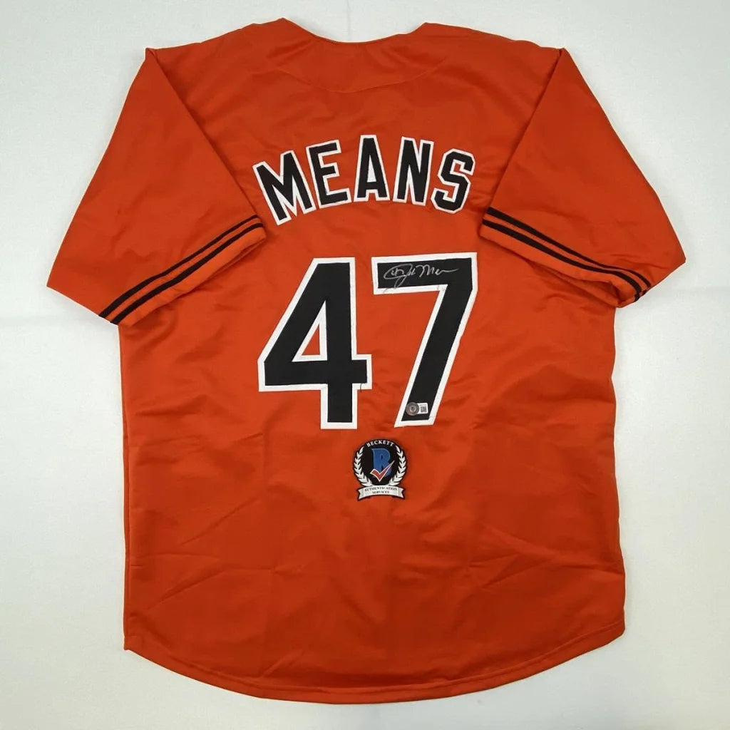 Orange custom jersey with black and white lettering for professional sports league gear