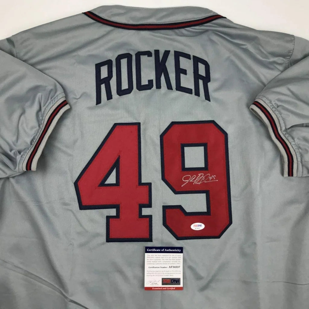 Grey professional sports custom jersey with ROCKER 49 signature and authentication