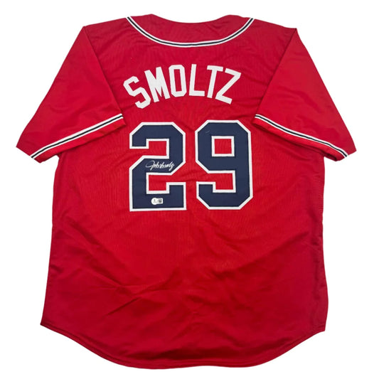 Red signed SMOLTZ 29 custom jersey for professional sports league gear display