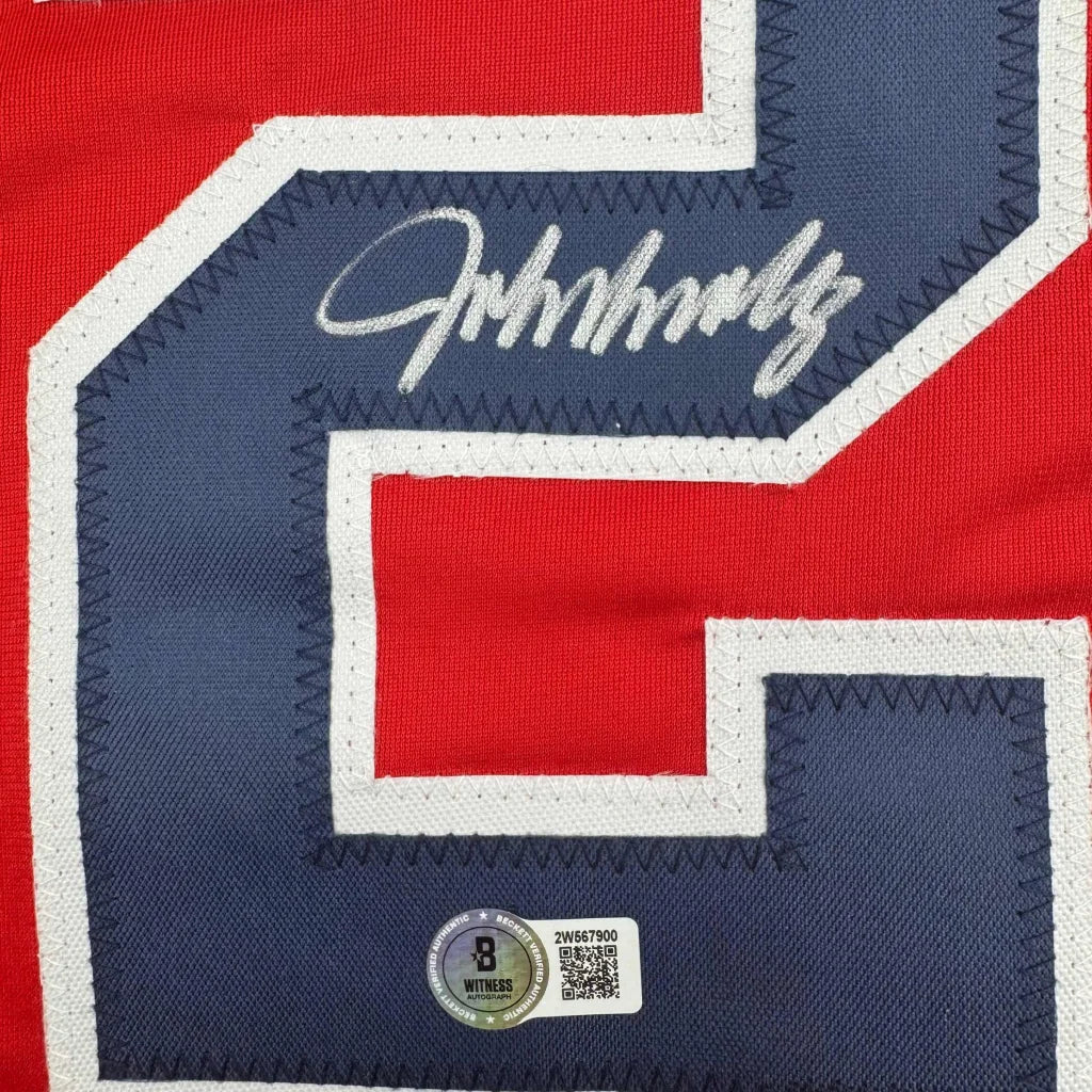 Autographed red and navy custom jersey from a professional sports league with signature