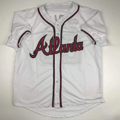 White custom jersey with red and navy trim from professional sports league Smoltz 29