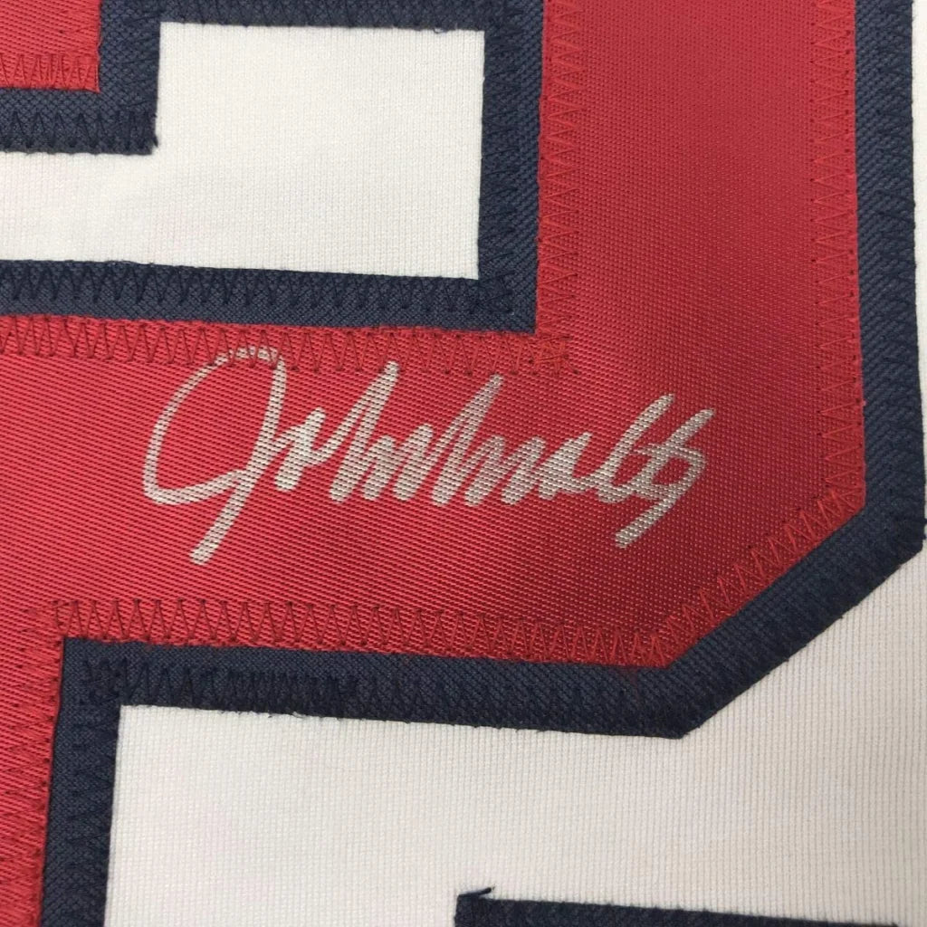 Red and white custom jersey with signature from professional sports league star