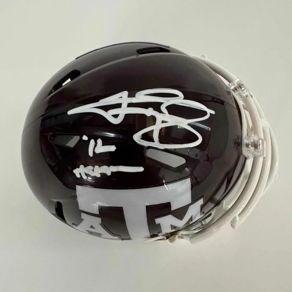 Dark maroon Texas A&M mini football helmet with white autographs and third party authentication