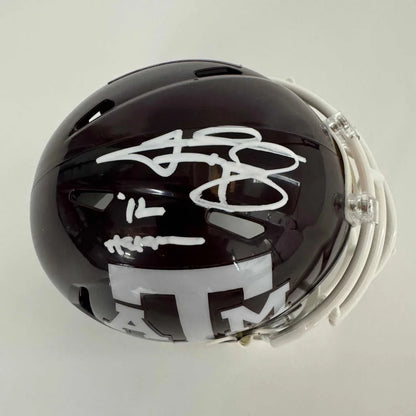 Dark maroon Texas A&M mini football helmet with white autographs and third party authentication