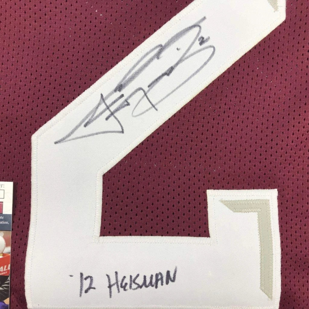 White number 2 patch with black ink signature and handwritten name on maroon mesh custom jersey for professional sports league