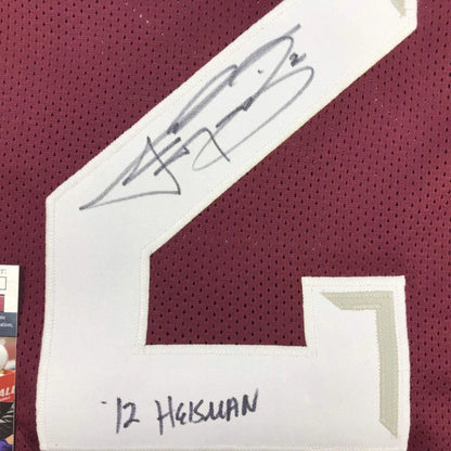 White number 2 patch with black ink signature and handwritten name on maroon mesh custom jersey for professional sports league