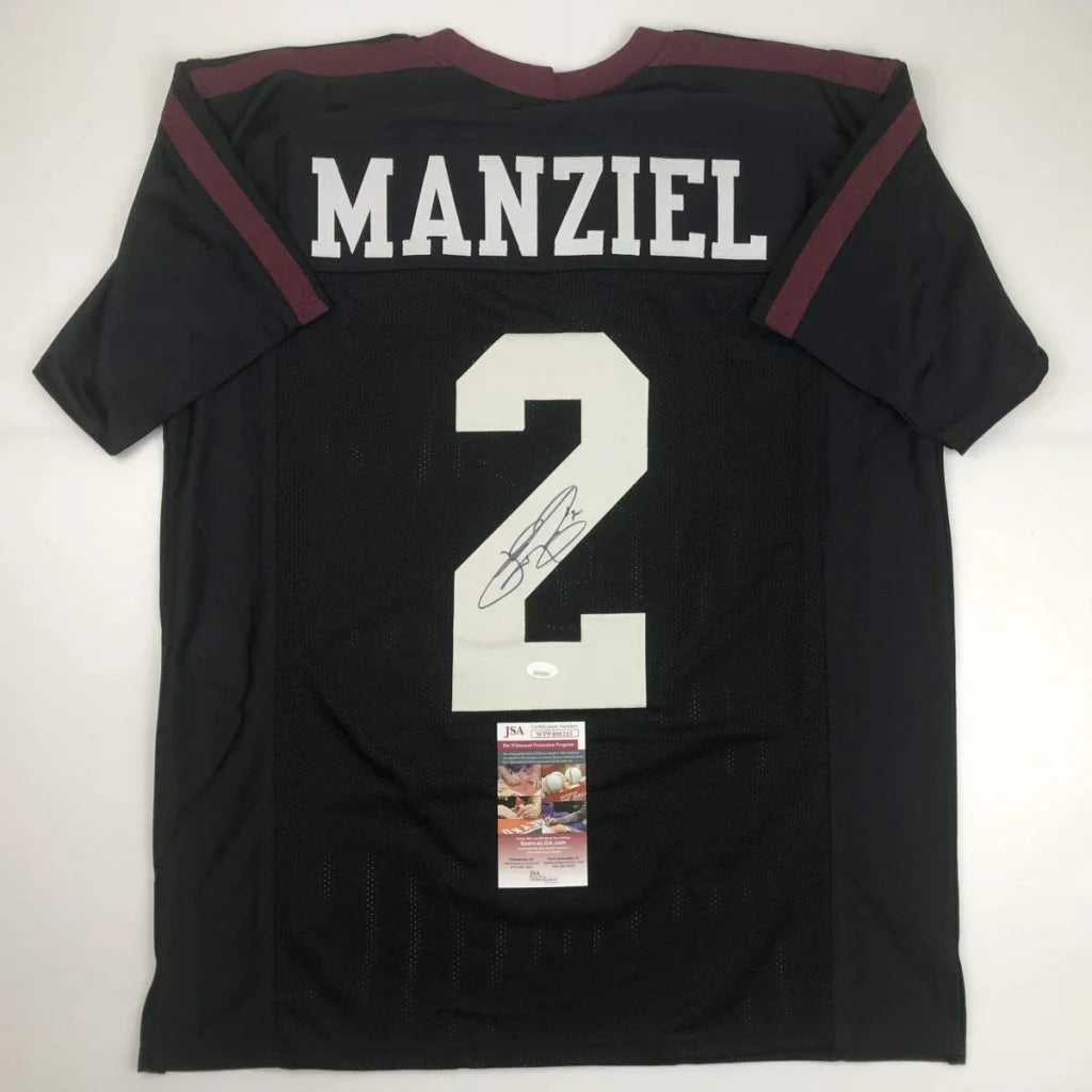 Back of a black custom football jersey with maroon trim autographed by Johnny Manziel from a professional sports league