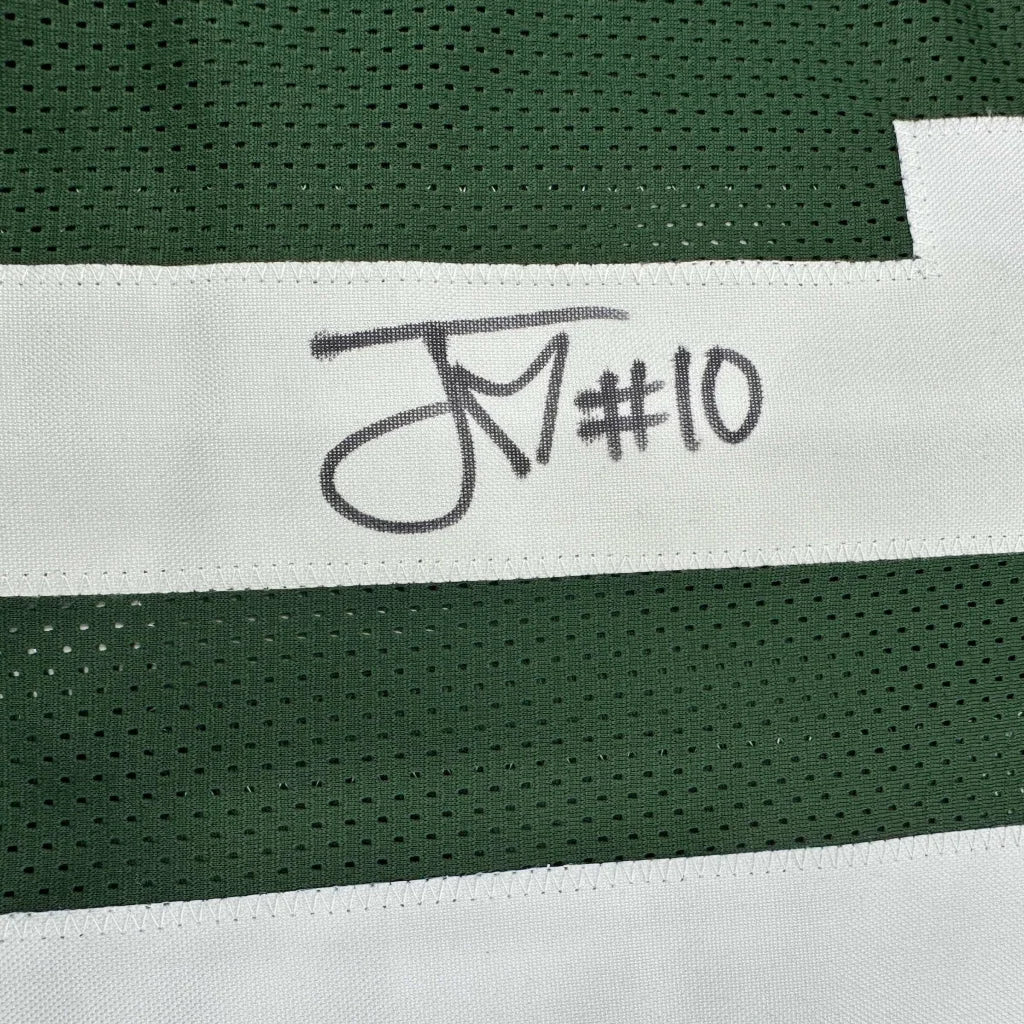 Autographed green and white custom jersey from a professional sports league collectible