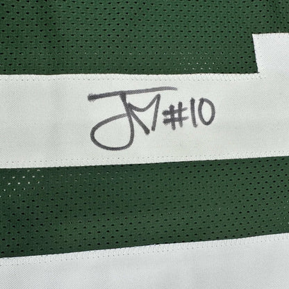 Autographed green and white custom jersey from a professional sports league collectible