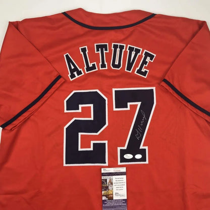 Back of red custom jersey featuring black and white lettering with Altuve 27 autograph from professional sports league player