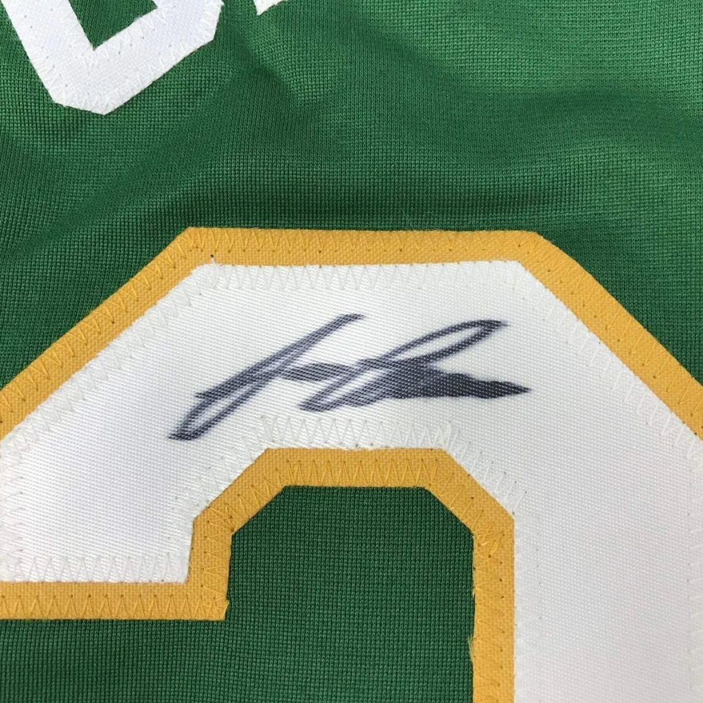 Green custom jersey with white and gold number and black autograph, perfect for sports league fans