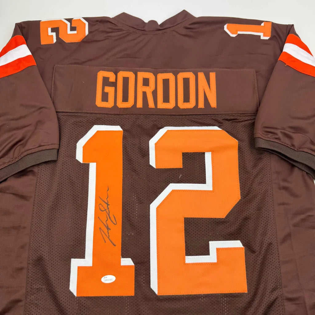 Signed Brown American Football Jersey with orange and white numbers, perfect for professional sports fans