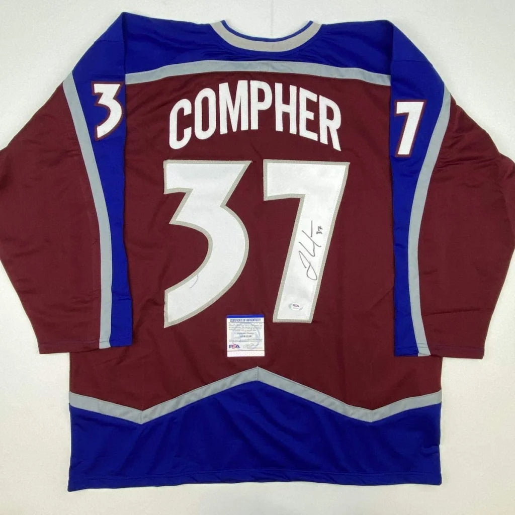 Maroon professional sports league custom jersey with blue grey accents and JT Compher autograph