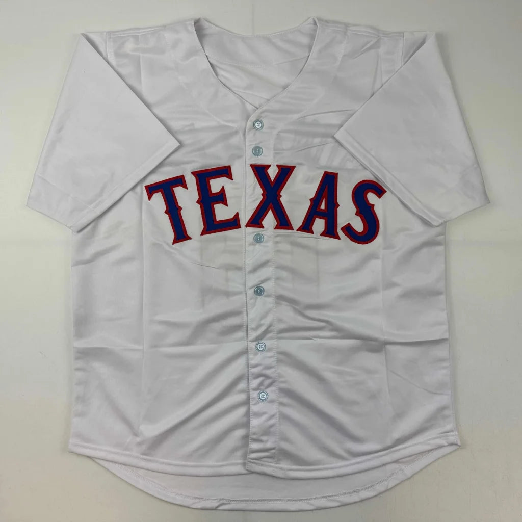 Autographed Juan Gonzalez white Texas baseball jersey with red blue lettering