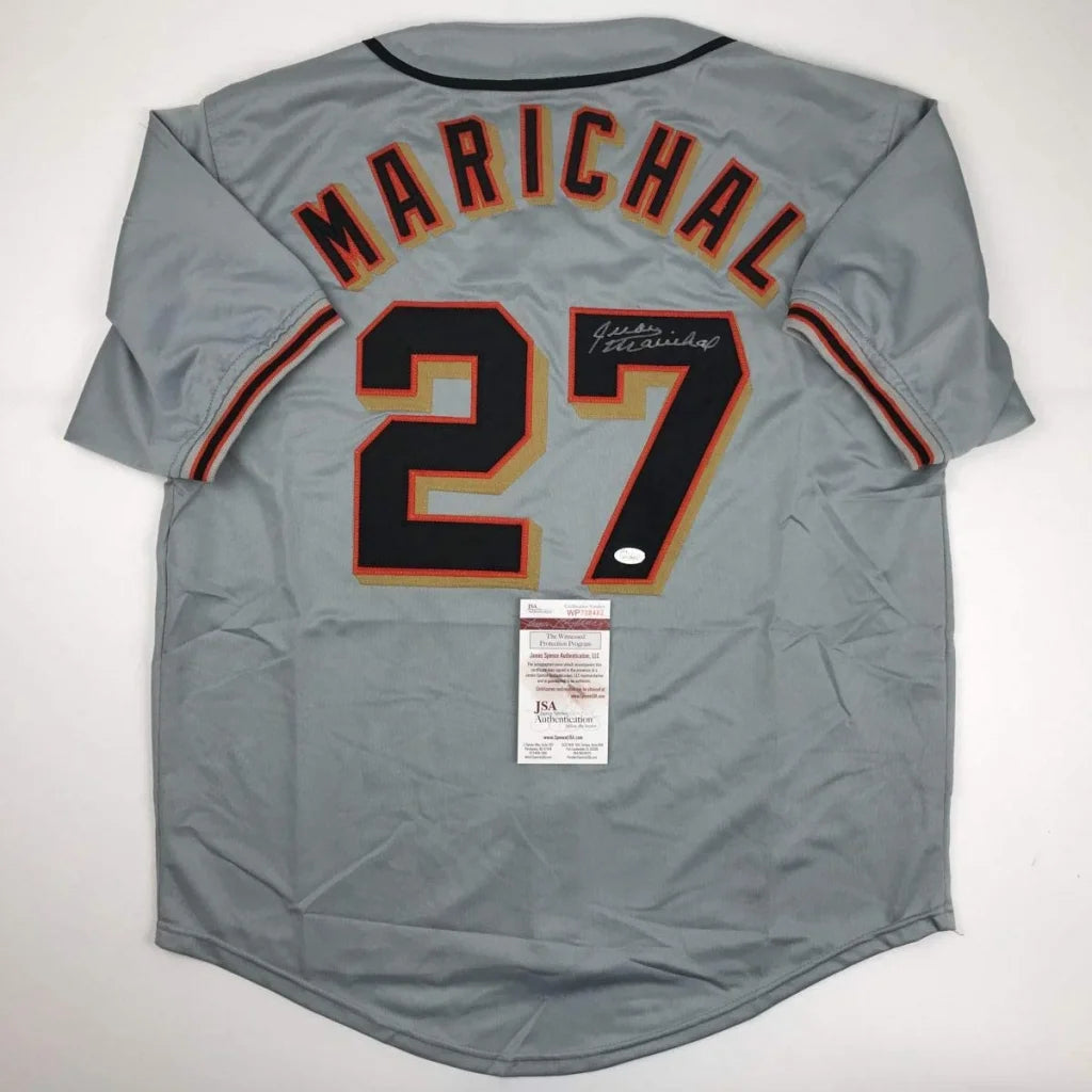 Back of a gray autographed juan marichal san francisco baseball jersey with custom number 27 in professional sports league style