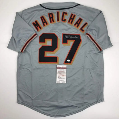 Back of a gray autographed juan marichal san francisco baseball jersey with custom number 27 in professional sports league style