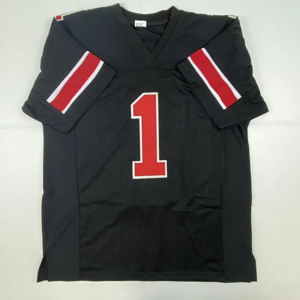 Black autographed Justin Fields Ohio State college football custom jersey with red white sleeve stripes and number one for professional sports league fans