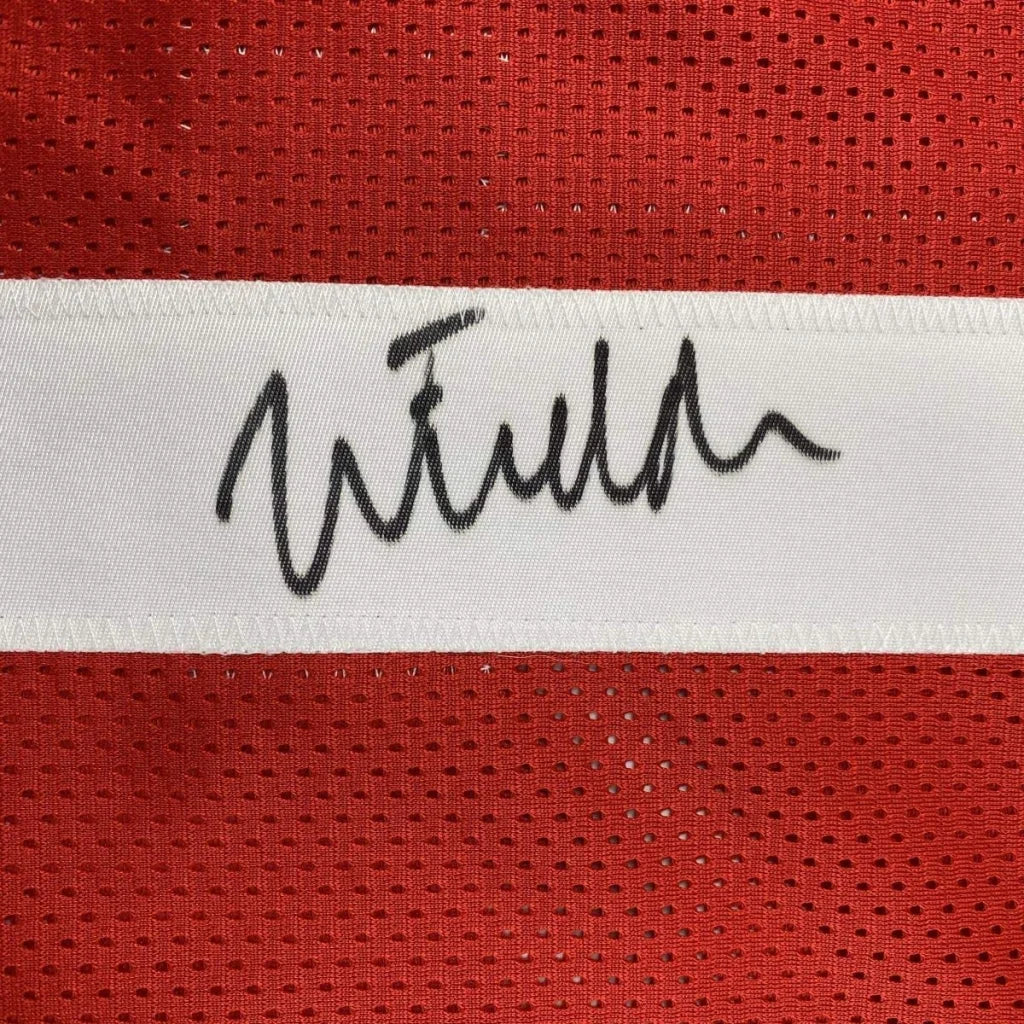 Autographed black ink signature on white stripe of red mesh ohio state football custom jersey for professional sports league