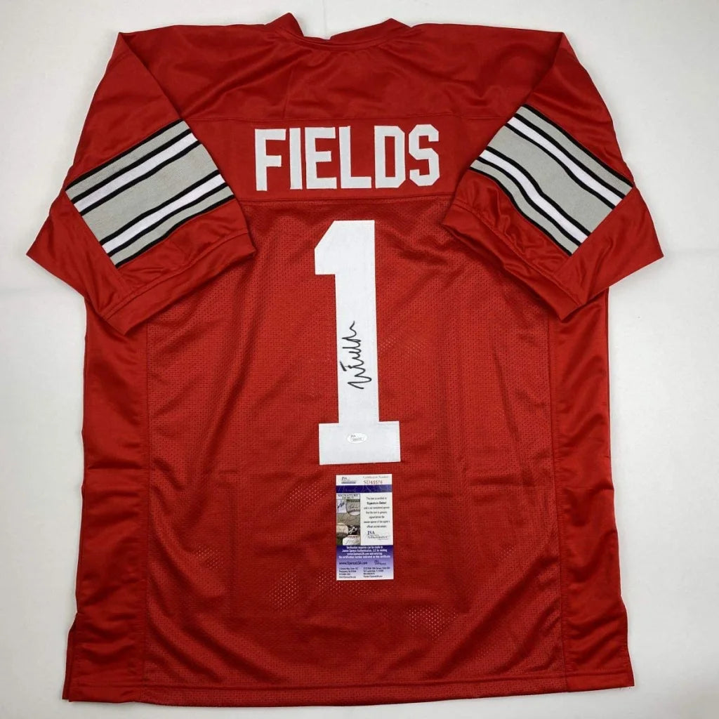 Autographed ohio state red football jersey custom signed by Justin Fields with silver black striped sleeves for professional sports fans