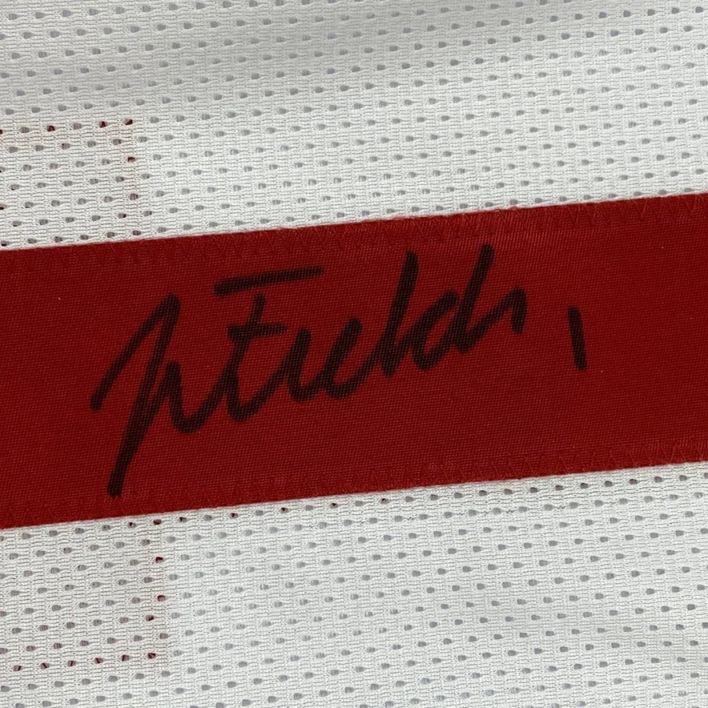Autographed black ink signature on red fabric strip of ohio state white college football custom jersey for professional sports league