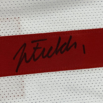 Autographed black ink signature on red fabric strip of ohio state white college football custom jersey for professional sports league
